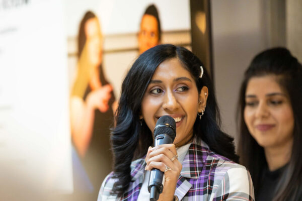 A Speaker holding a microphone at a Stemettes event