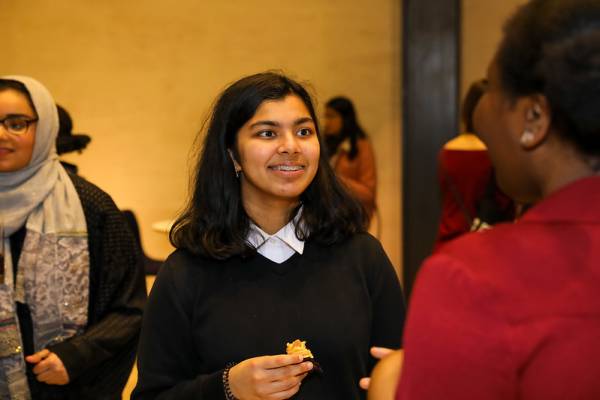 A person speaking to another at a Stemettes event.