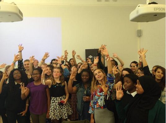 All of the outbox incubator attendees smiling and posing holding up a 'O' shape with their hands.