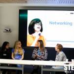 A group of Stemettes talking in front of a board that reads "Networking".