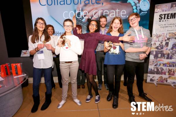 A group of Stemettes holding trophies and celebrating.