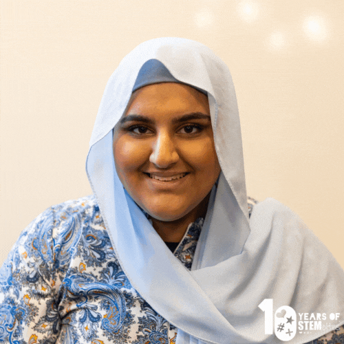 GIF of SFYB Manahil smiling and posing against a light wall