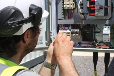 Engineer fixing a Limejump battery | Stemettes Zine