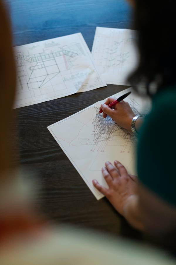 Woman drafting architectural plans